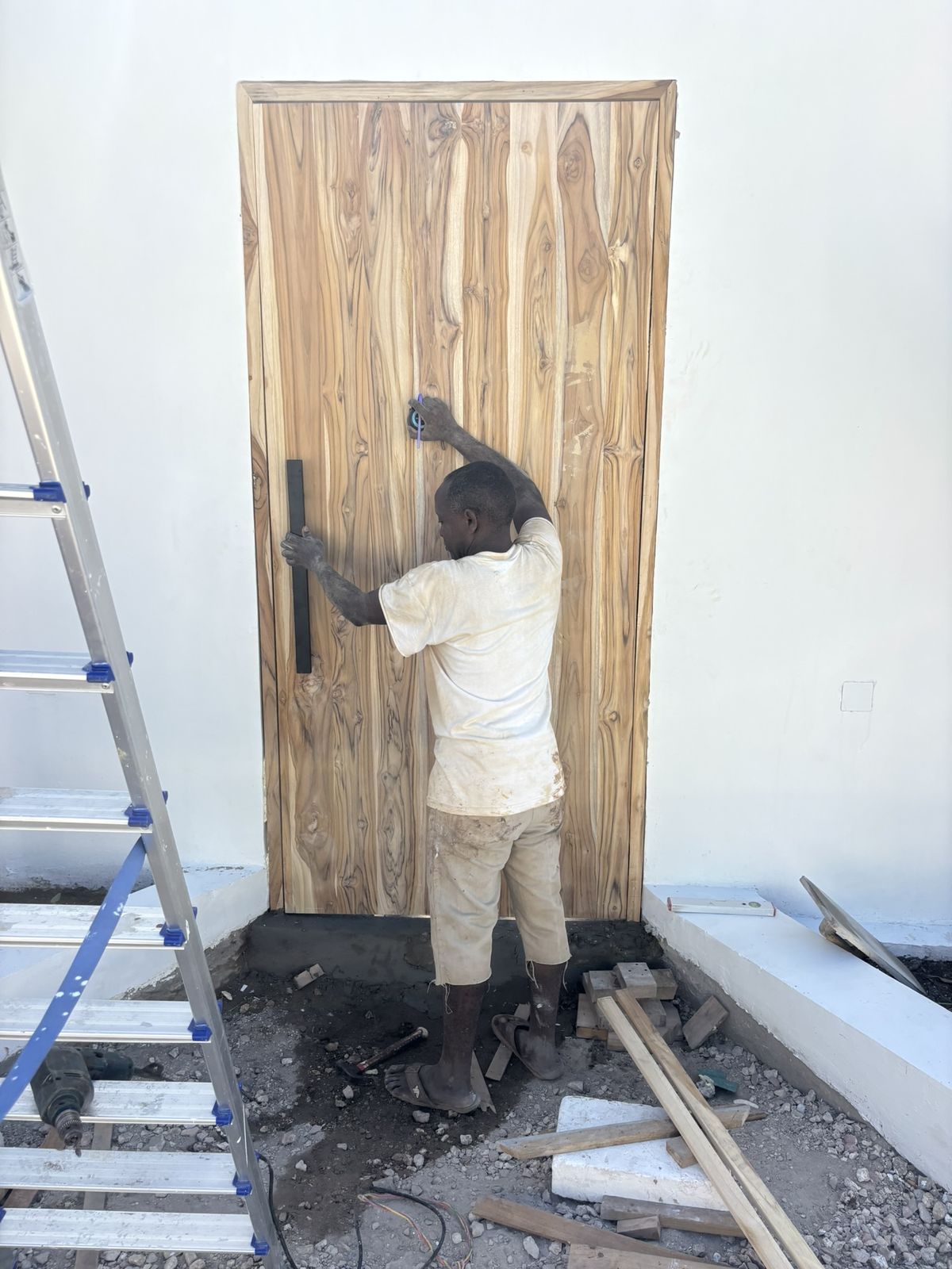Final work on a teak door, May 2026